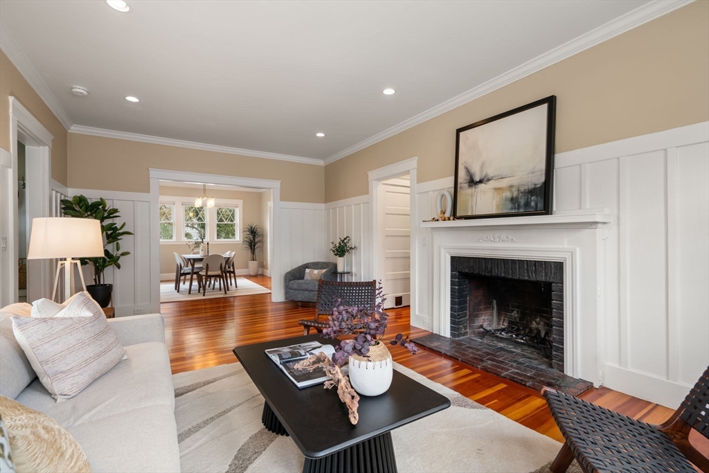 44 Norfolk Street Needham, MA 02492 - Photo 8 of 28 a living room with furniture and a fireplace