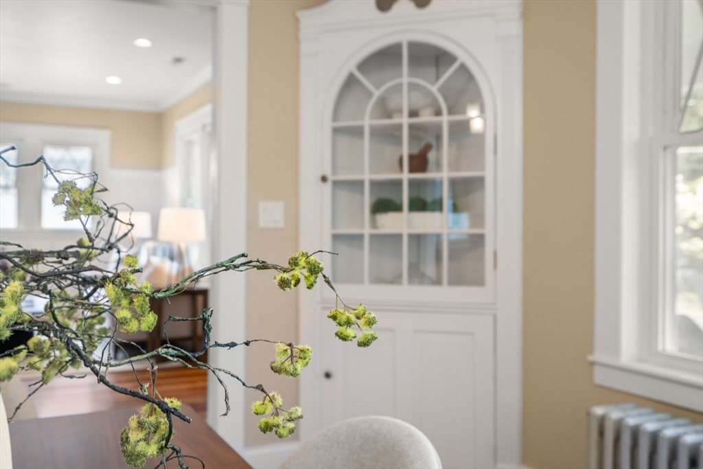 44 Norfolk Street Needham, MA 02492 - Photo 10 of 28 a vase of flowers sitting on a table in a living room