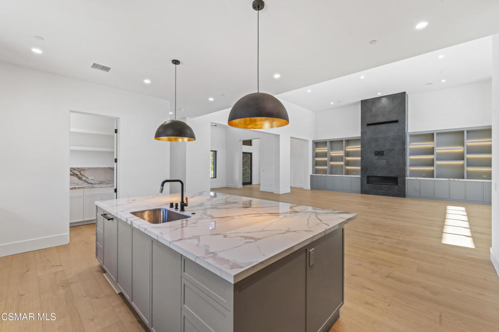 532 Corte Corrida Camarillo, CA 93010 - Photo 17 of 76 a kitchen with stainless steel appliances granite countertop a sink a oven and a large window
