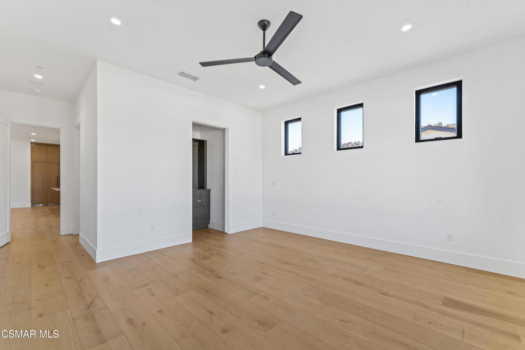 532 Corte Corrida Camarillo, CA 93010 - Photo 23 of 76 an empty room with closet and a ceiling fan