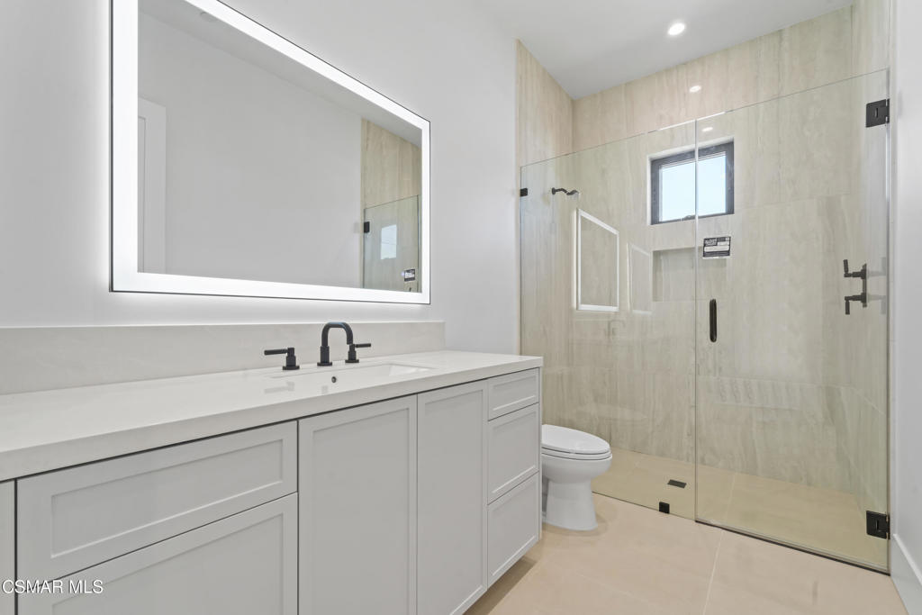 532 Corte Corrida Camarillo, CA 93010 - Photo 24 of 76 a bathroom with a sink a toilet and shower