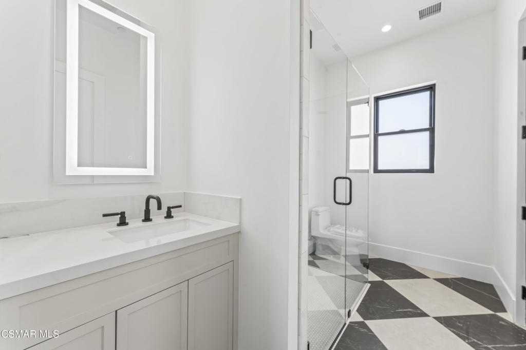 532 Corte Corrida Camarillo, CA 93010 - Photo 49 of 76 a bathroom with a sink and a mirror