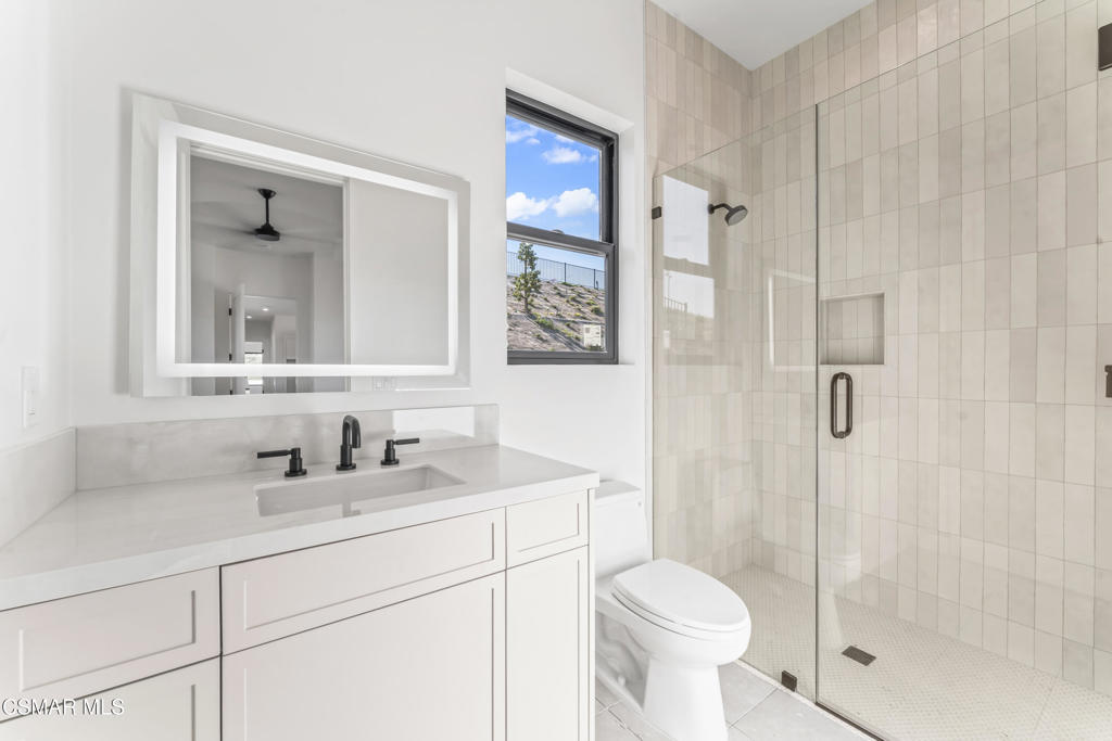 532 Corte Corrida Camarillo, CA 93010 - Photo 51 of 76 a bathroom with a toilet sink and shower