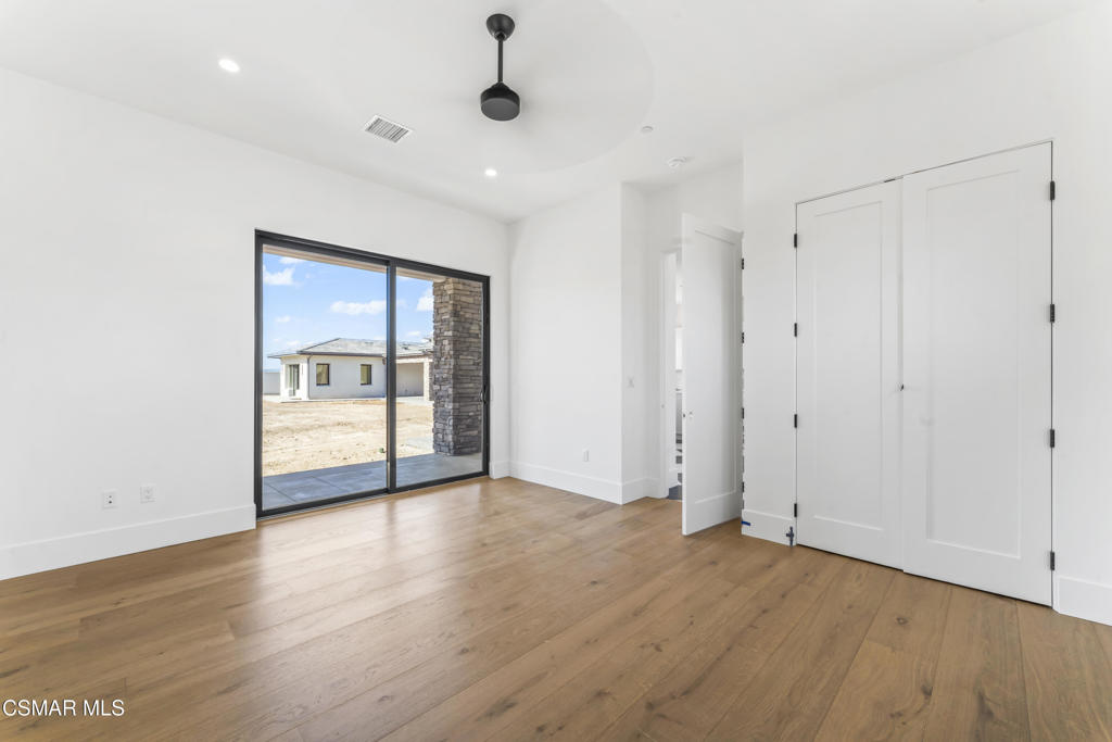532 Corte Corrida Camarillo, CA 93010 - Photo 54 of 76 an empty room with wooden floor and windows