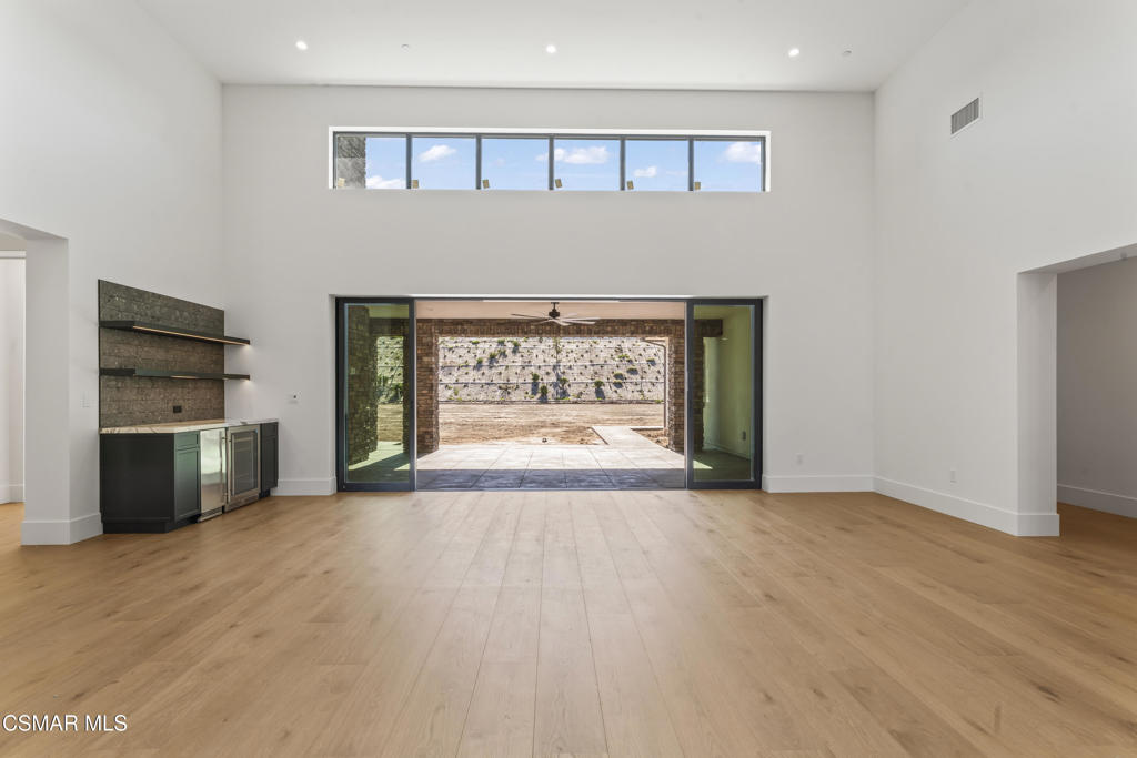 532 Corte Corrida Camarillo, CA 93010 - Photo 57 of 76 a view of an empty room with a fireplace and a window