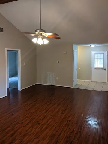 a view of a livingroom with wooden floor