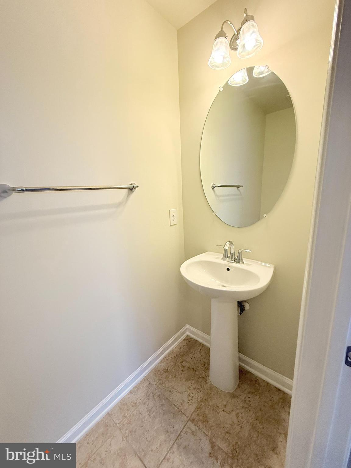 6082 Forum Square Frederick, MD 21703 - Photo 11 of 63 a bathroom with a sink a mirror and vanity