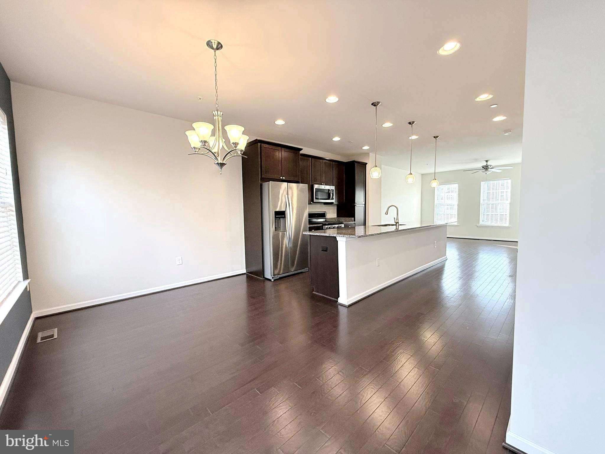 6082 Forum Square Frederick, MD 21703 - Photo 14 of 63 a view of a kitchen with a sink and a refrigerator
