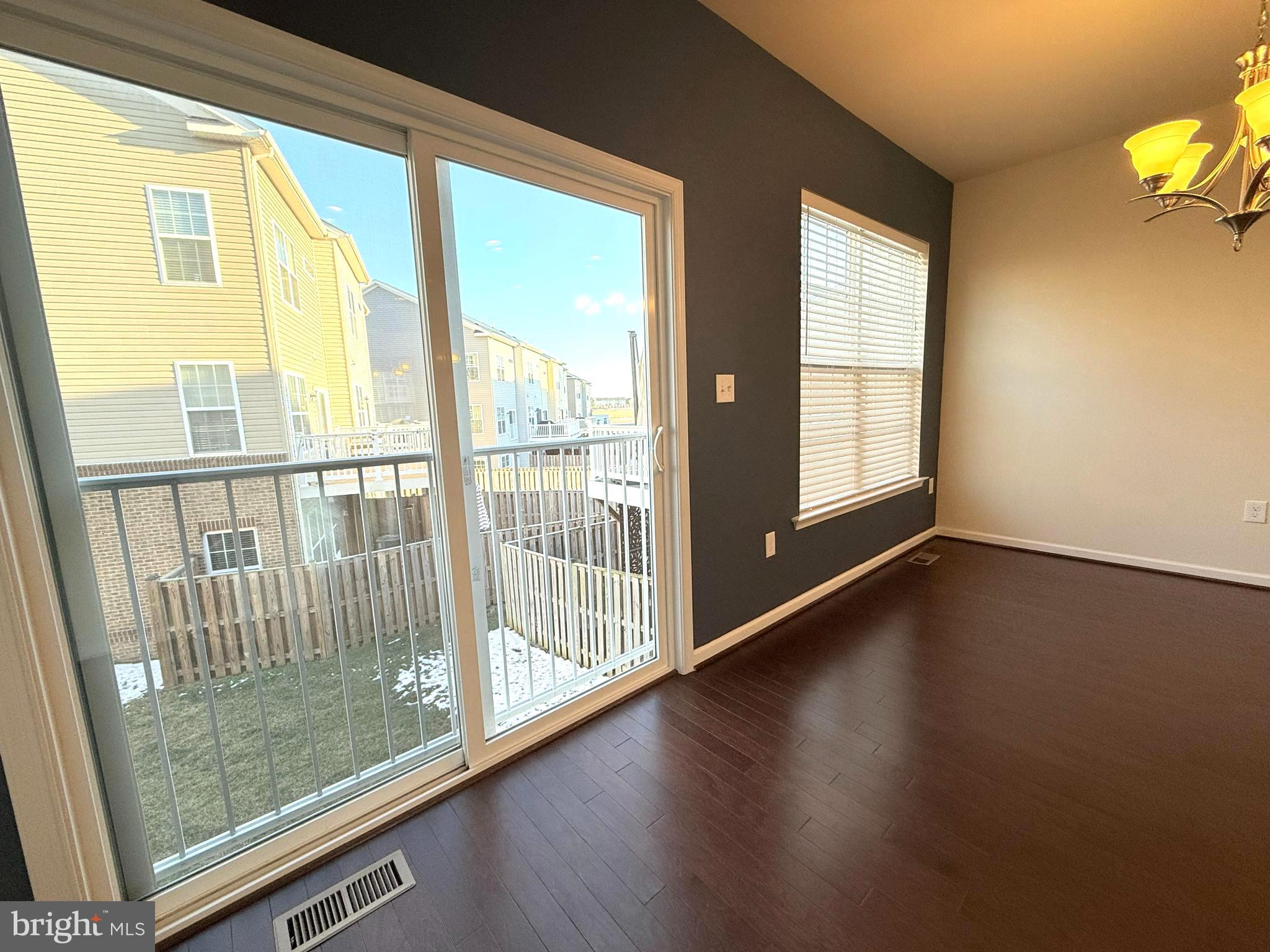6082 Forum Square Frederick, MD 21703 - Photo 15 of 63 a view of a room with wooden floor and windows