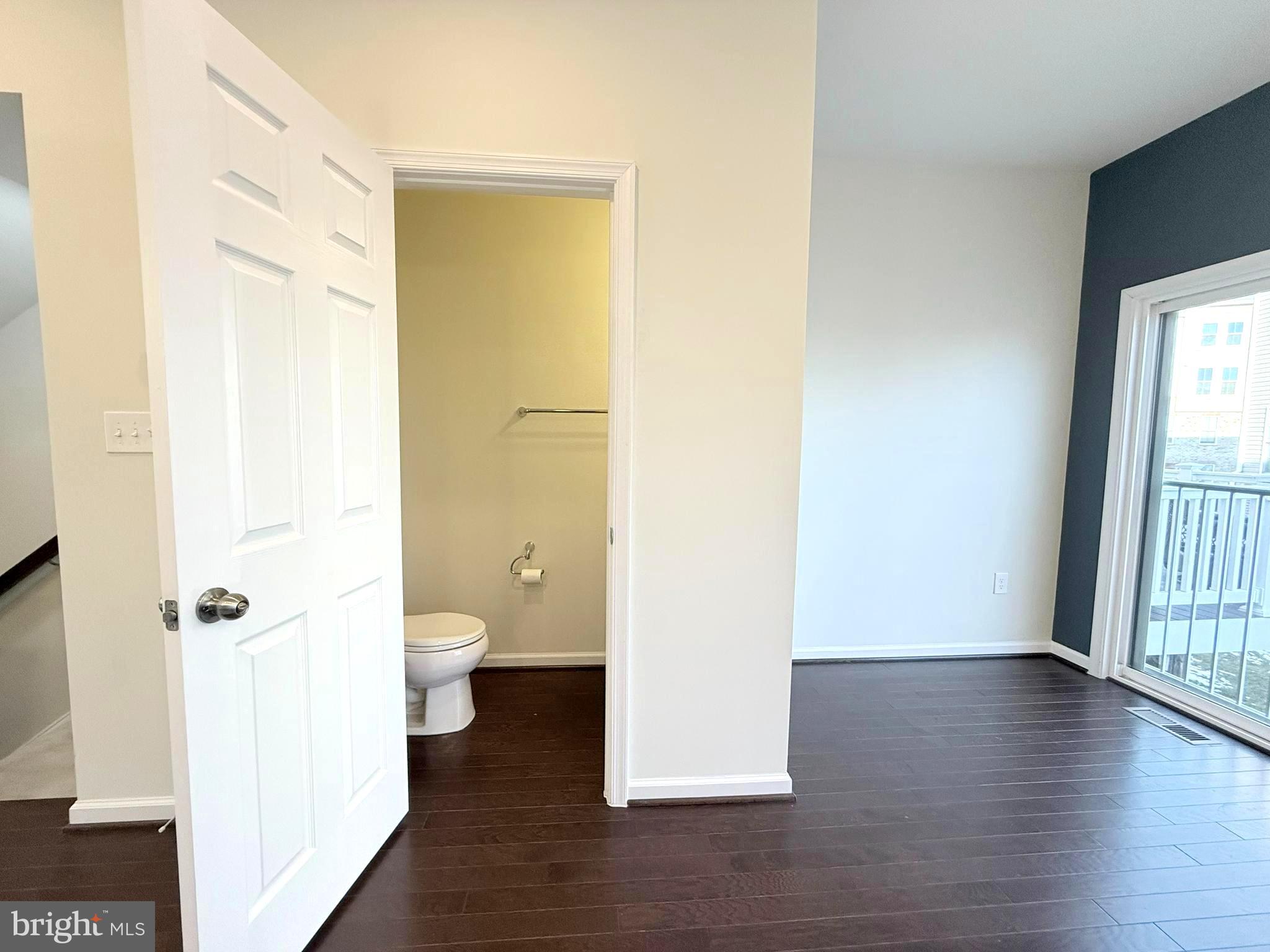 6082 Forum Square Frederick, MD 21703 - Photo 17 of 63 a view of a bathroom with a hardwood floor and a bathroom