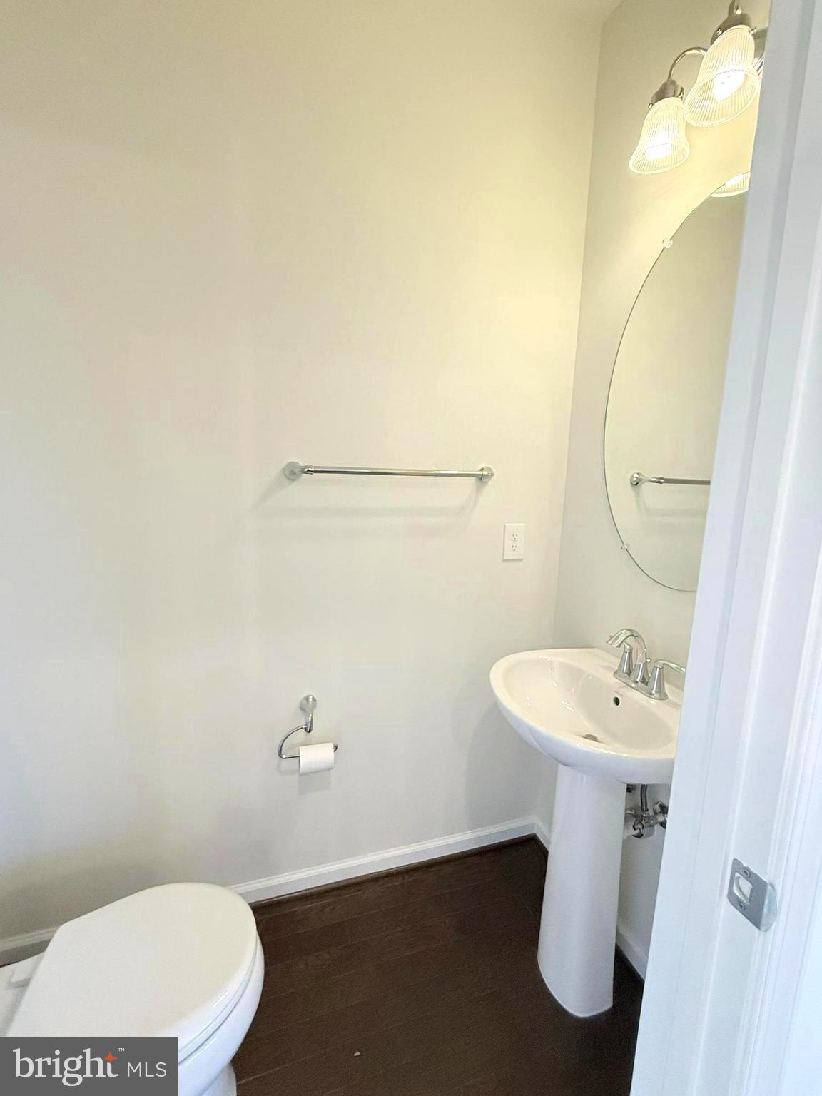 6082 Forum Square Frederick, MD 21703 - Photo 18 of 63 a bathroom with a sink a mirror and a toilet