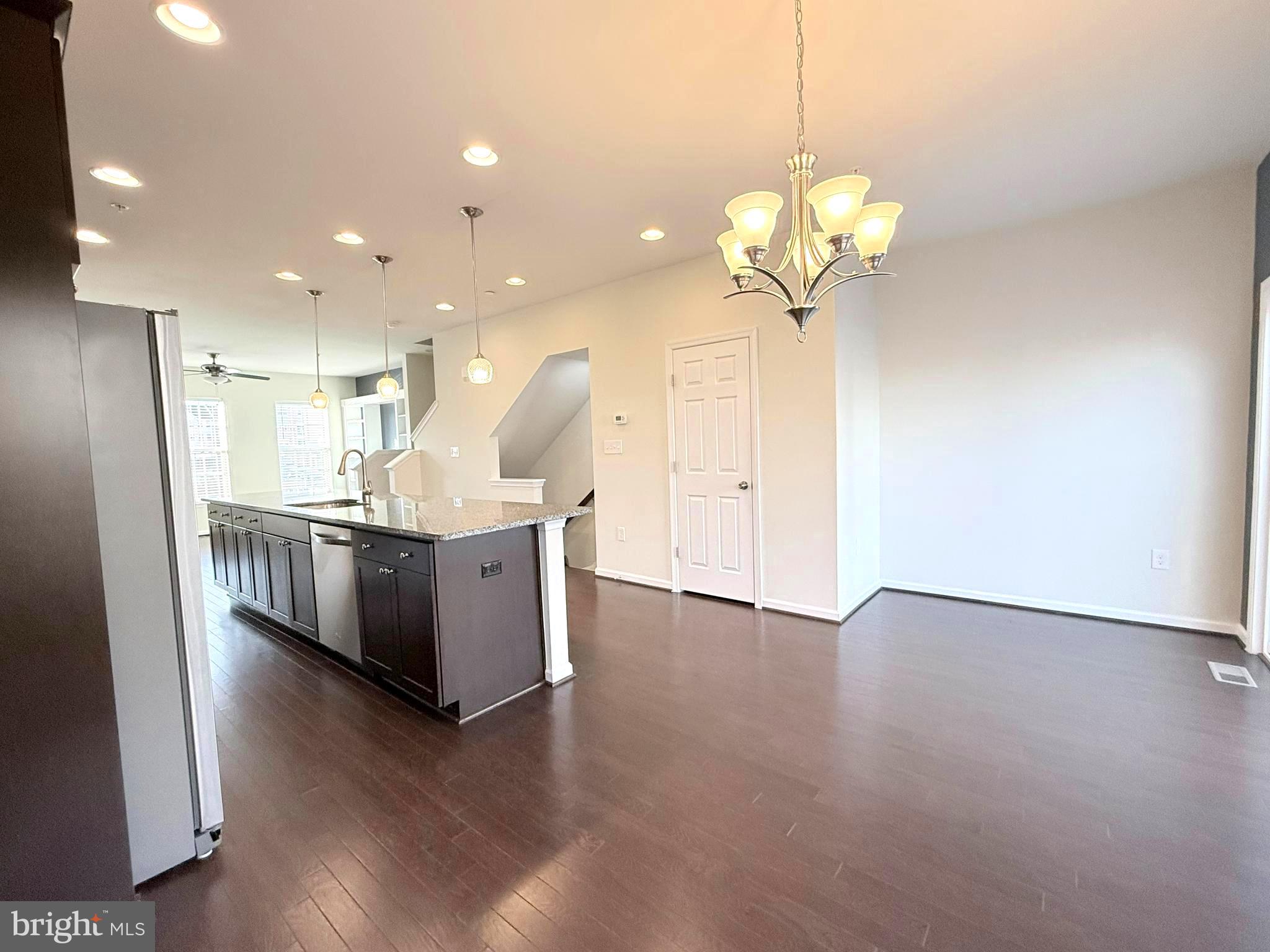 6082 Forum Square Frederick, MD 21703 - Photo 19 of 63 a view of a kitchen with a sink and a chandelier