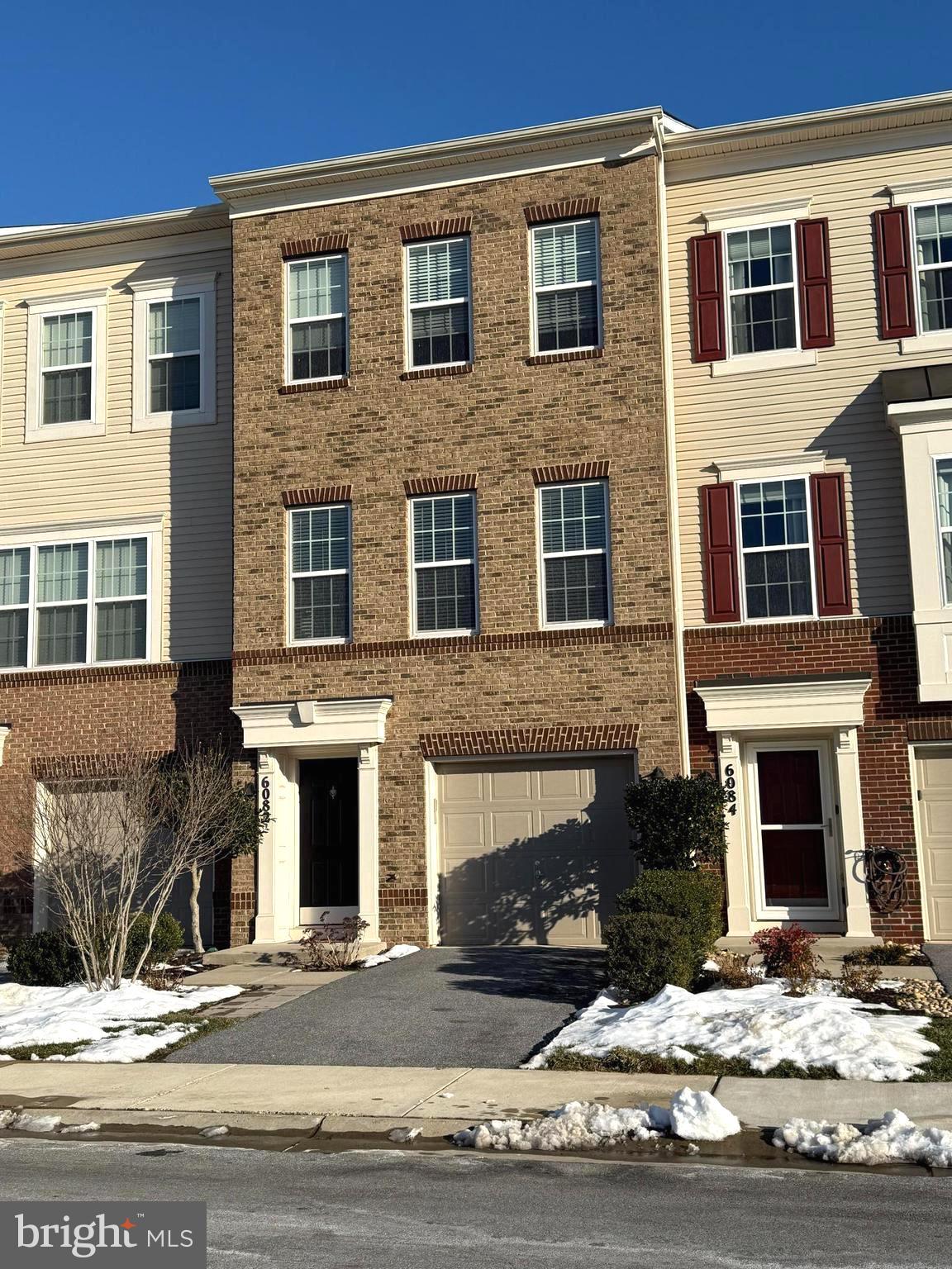 6082 Forum Square Frederick, MD 21703 - Photo 2 of 63 a front view of a house with yard