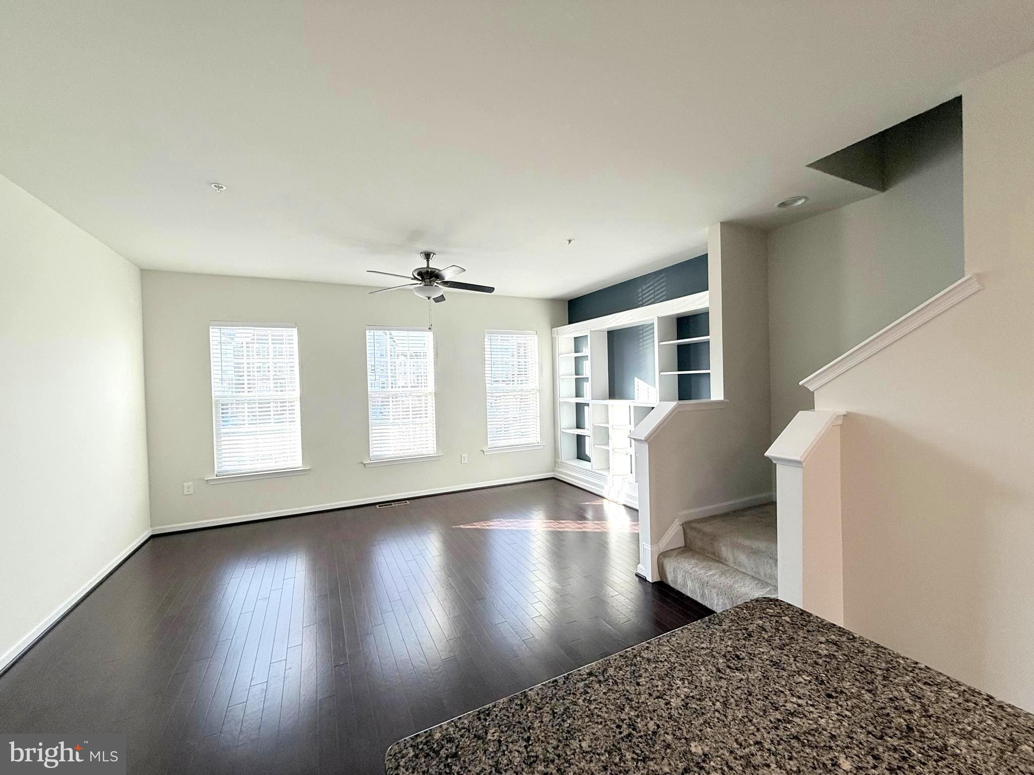 6082 Forum Square Frederick, MD 21703 - Photo 28 of 63 a view of an empty room with wooden floor and a window