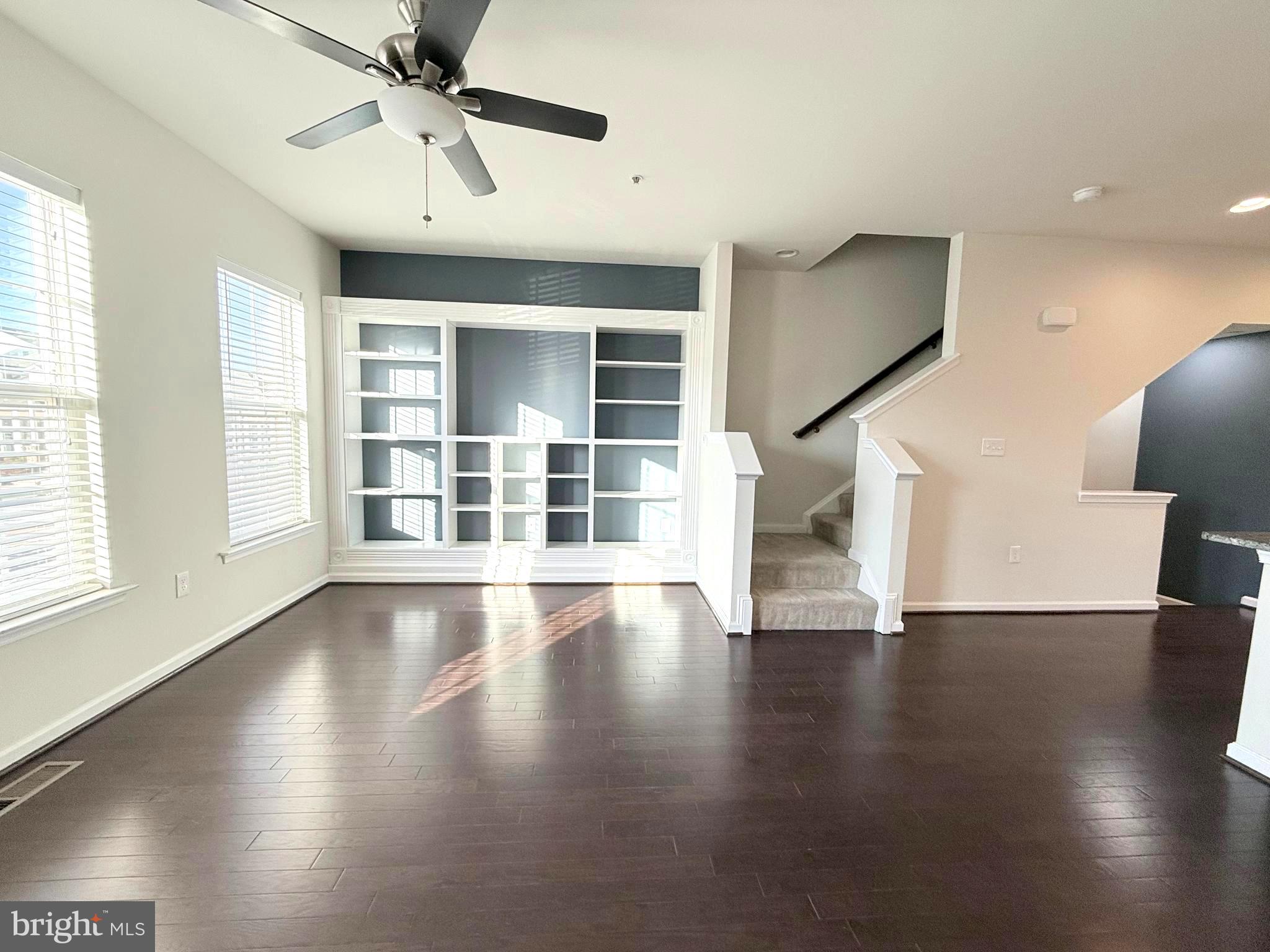 6082 Forum Square Frederick, MD 21703 - Photo 29 of 63 a view of an empty room with wooden floor and a window