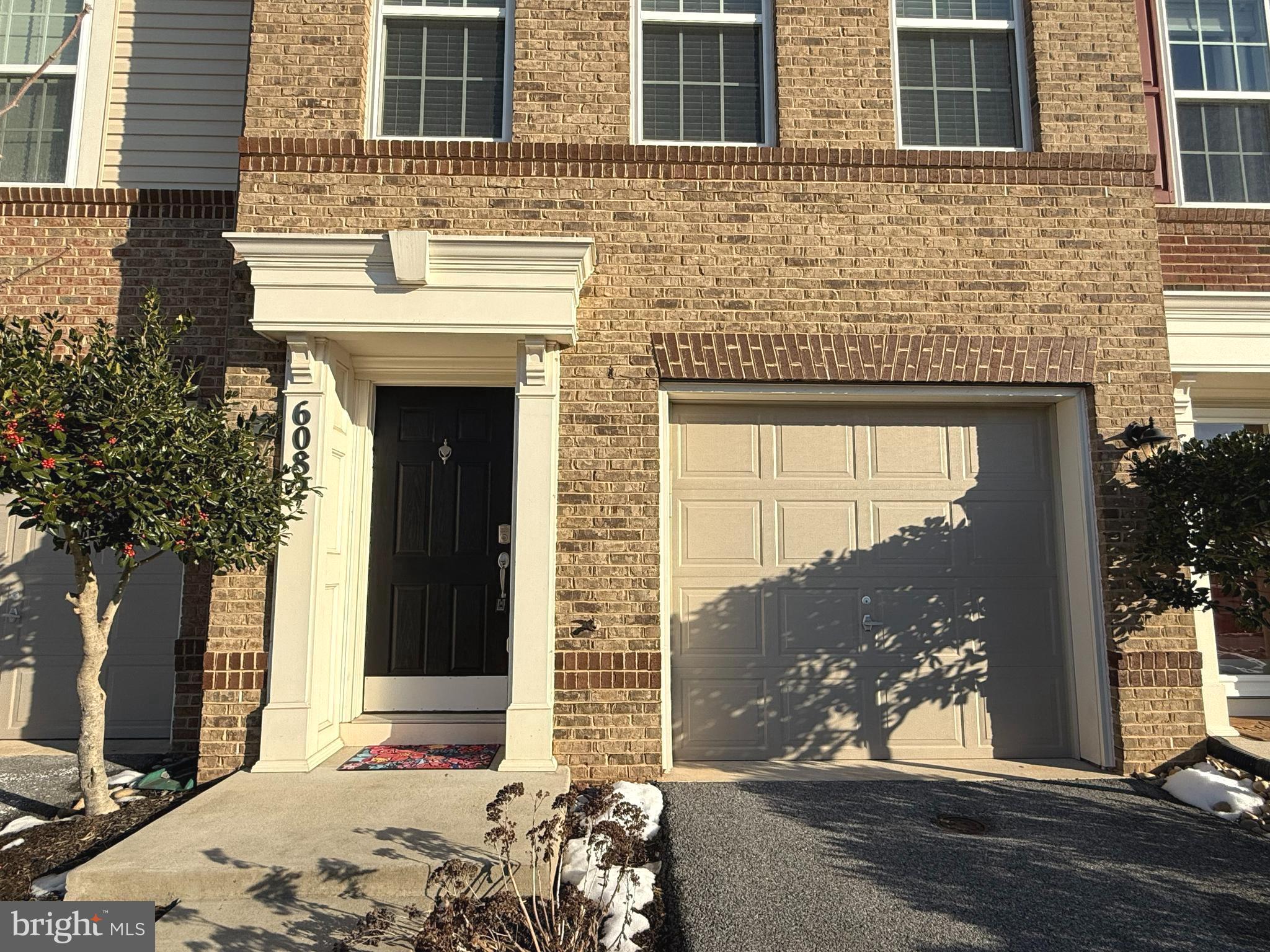 6082 Forum Square Frederick, MD 21703 - Photo 3 of 63 a front view of a house with a yard