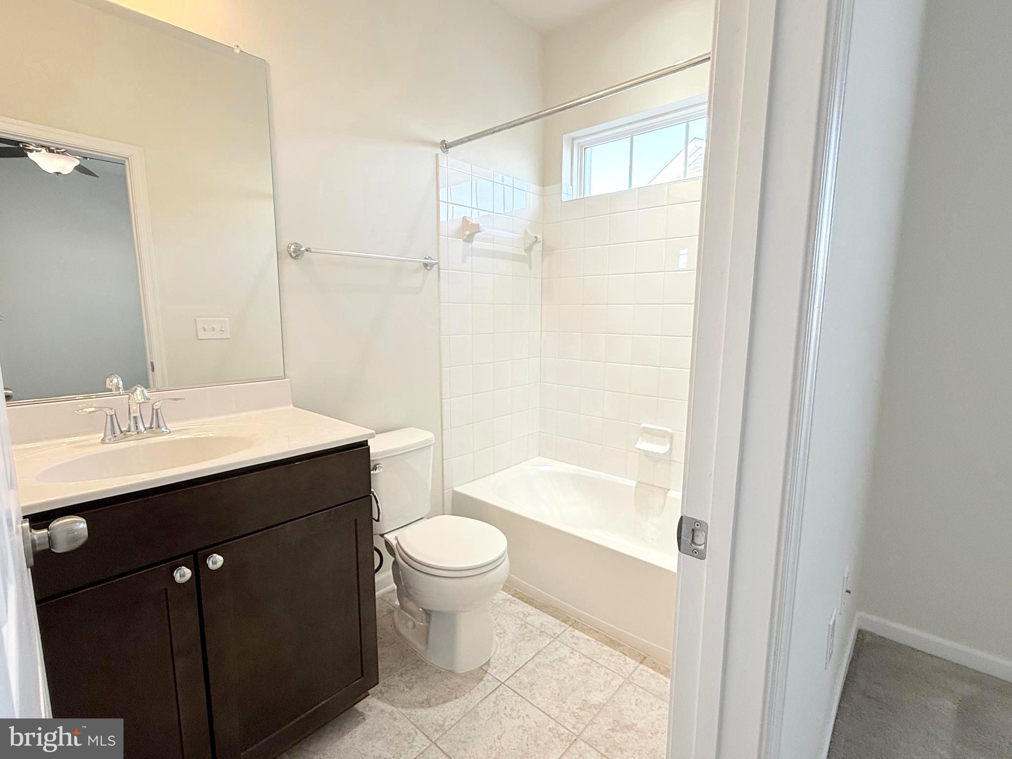 6082 Forum Square Frederick, MD 21703 - Photo 36 of 63 a bathroom with a bathtub shower sink vanity and toilet