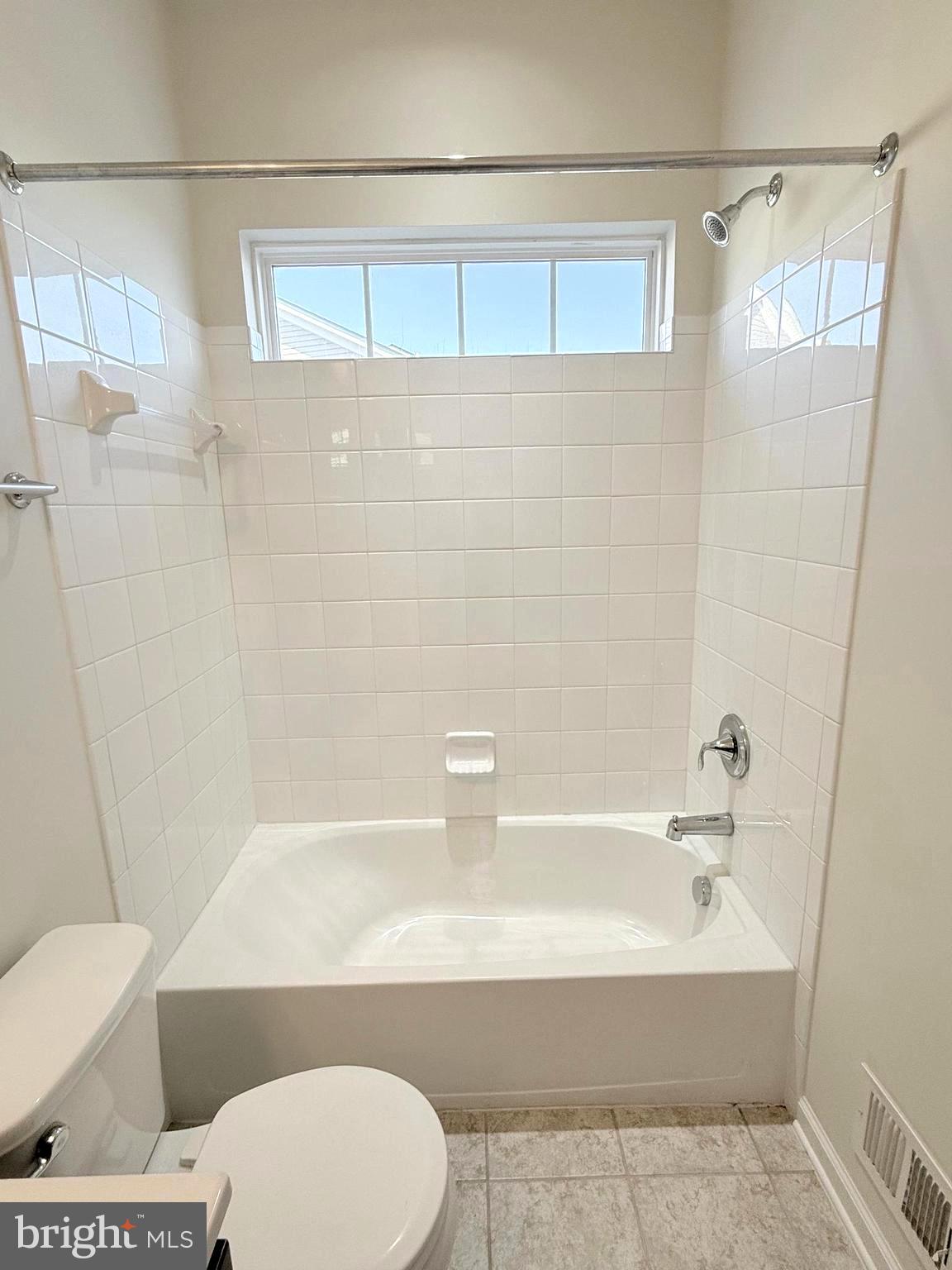 6082 Forum Square Frederick, MD 21703 - Photo 37 of 63 a bathroom with a toilet and a bathtub