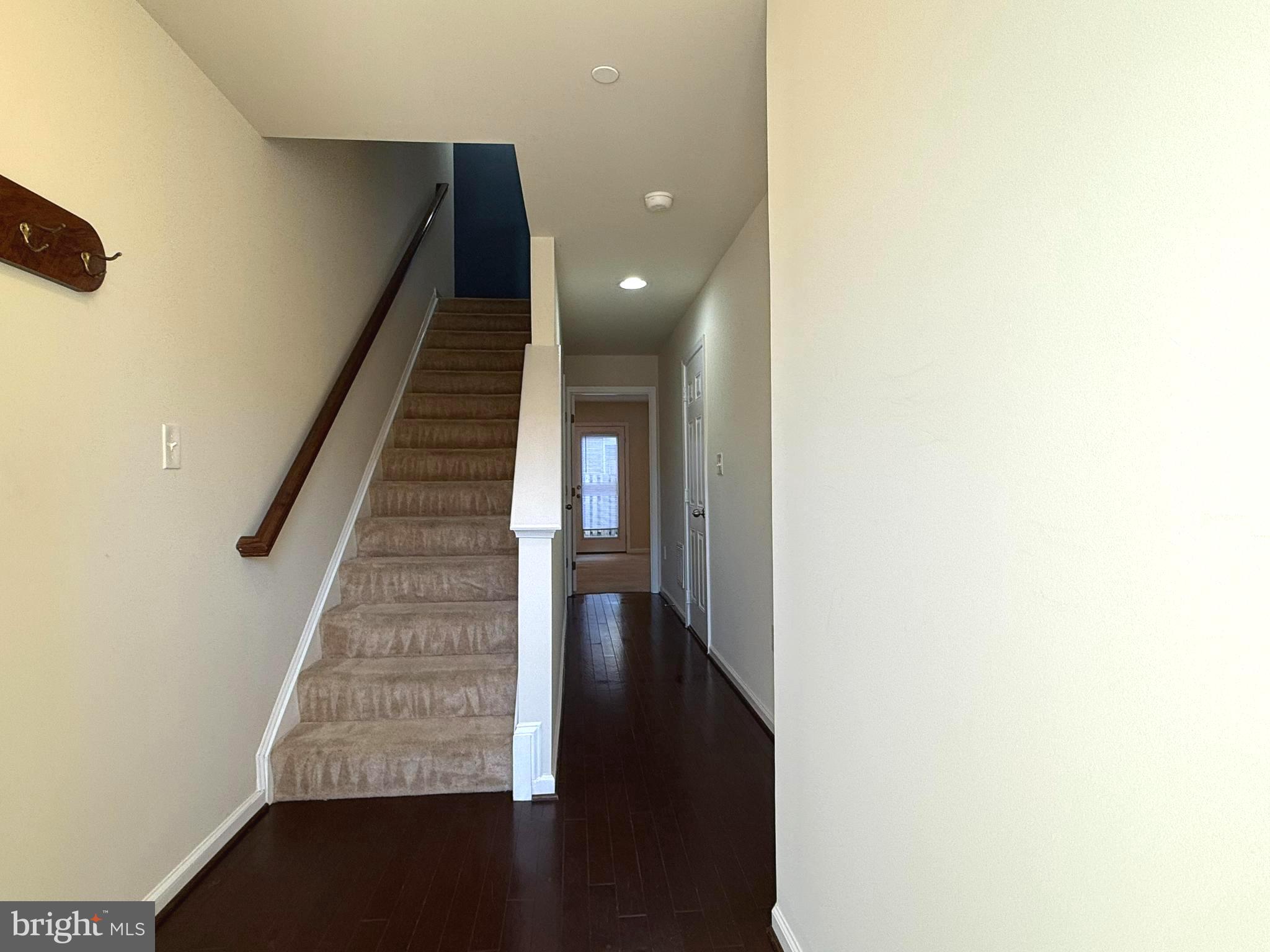 6082 Forum Square Frederick, MD 21703 - Photo 4 of 63 a view of entryway and hall with wooden floor