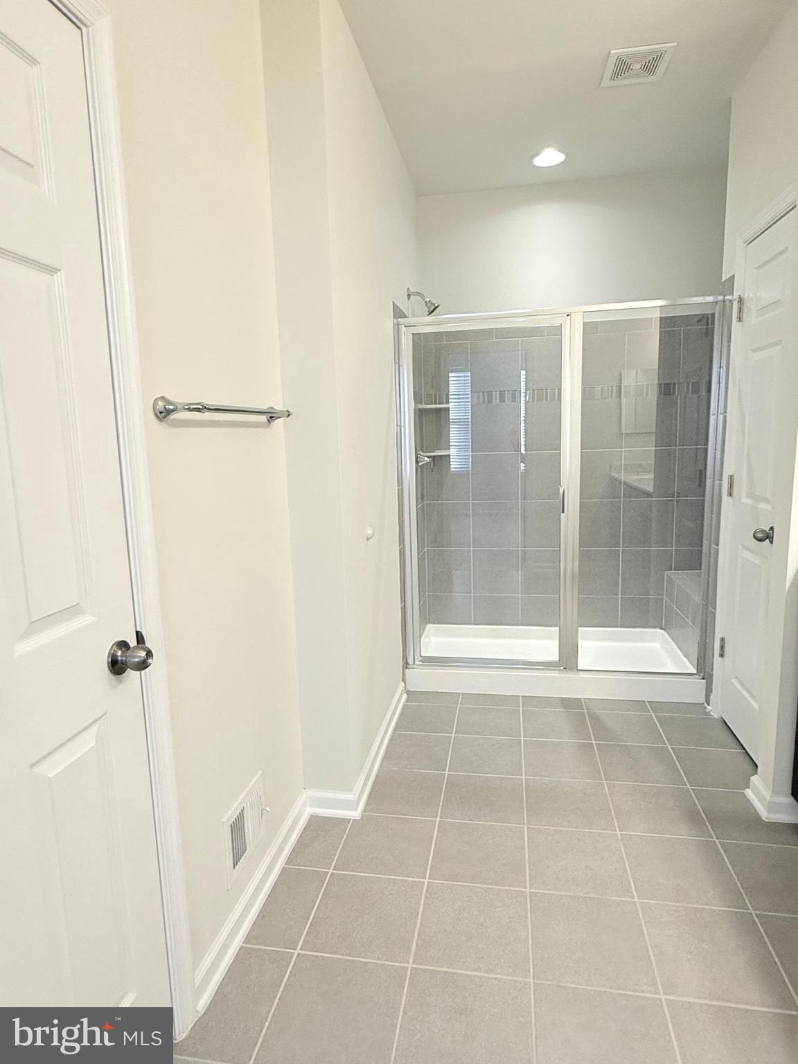 6082 Forum Square Frederick, MD 21703 - Photo 47 of 63 a bathroom with a shower and a bathtub