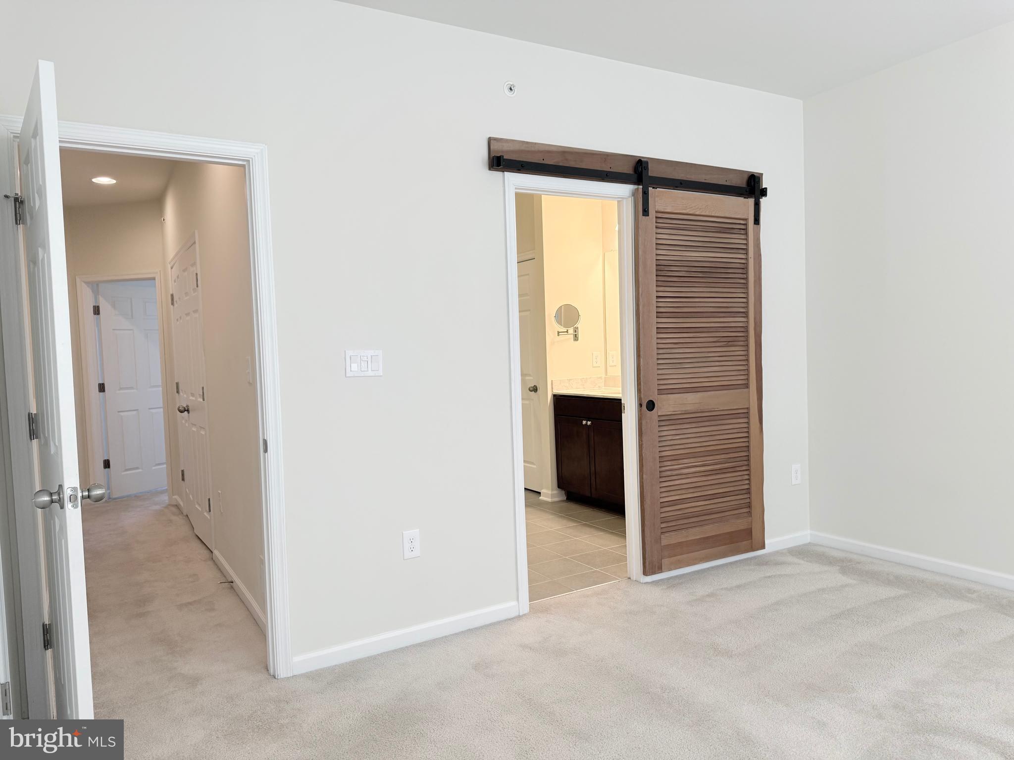 6082 Forum Square Frederick, MD 21703 - Photo 54 of 63 an empty room with closet and a bathroom