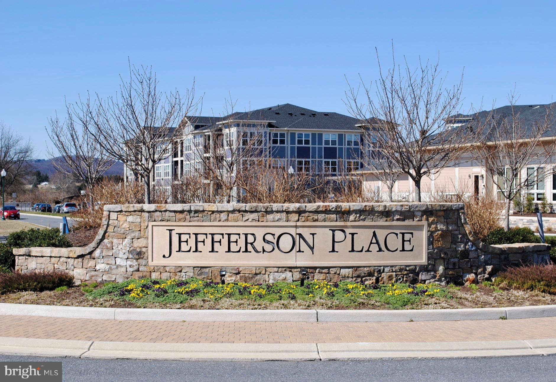 6082 Forum Square Frederick, MD 21703 - Photo 59 of 63 a front view of a building with garden and parking
