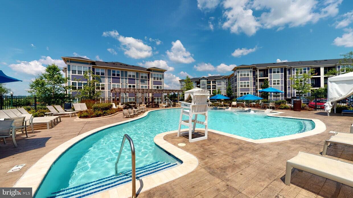6082 Forum Square Frederick, MD 21703 - Photo 62 of 63 a view of a swimming pool with a patio