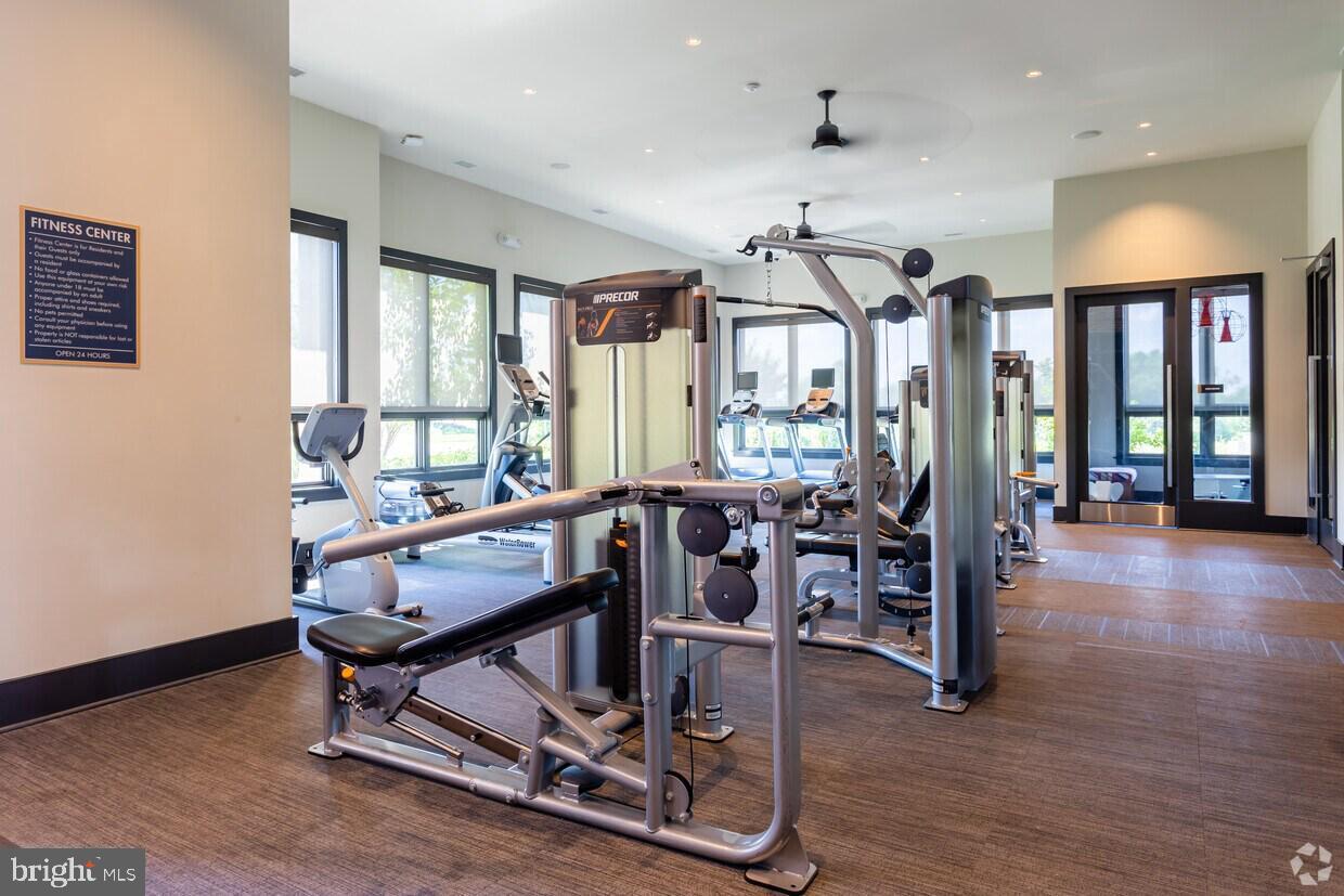 6082 Forum Square Frederick, MD 21703 - Photo 63 of 63 a room with lots of furniture and windows