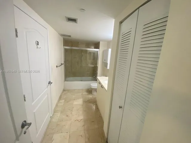 a bathroom with a shower and a toilet