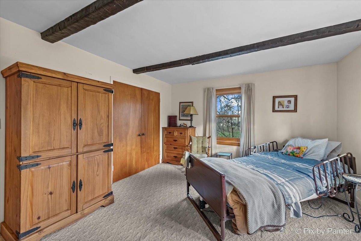 612-3 Three Oaks Road Cary, IL 60013 - Photo 18 of 48 a spacious bedroom with a bed and a dresser in it