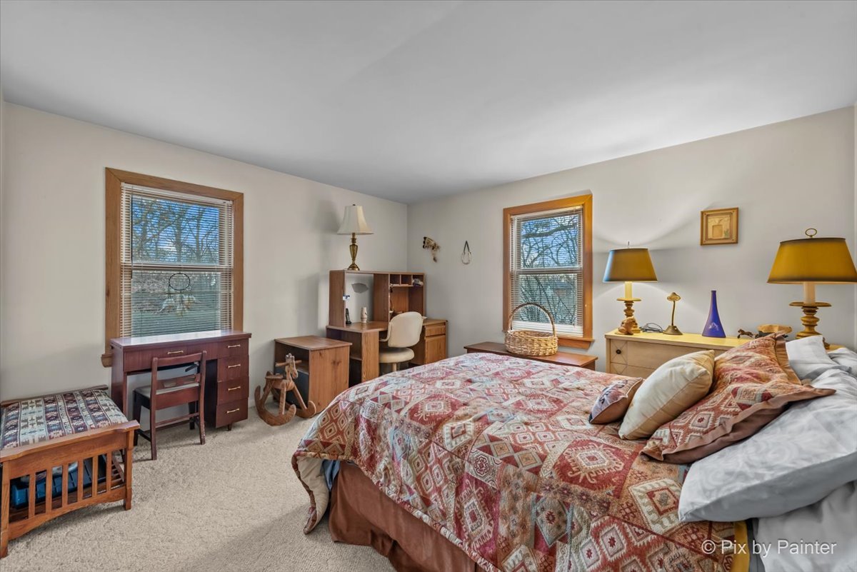 612-3 Three Oaks Road Cary, IL 60013 - Photo 20 of 48 a bedroom with a bed furniture a desk and chair