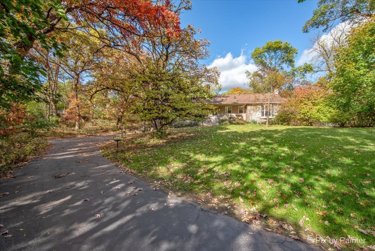 612-3 Three Oaks Road Cary, IL 60013 - Photo 2 of 48 a view of a yard with an trees