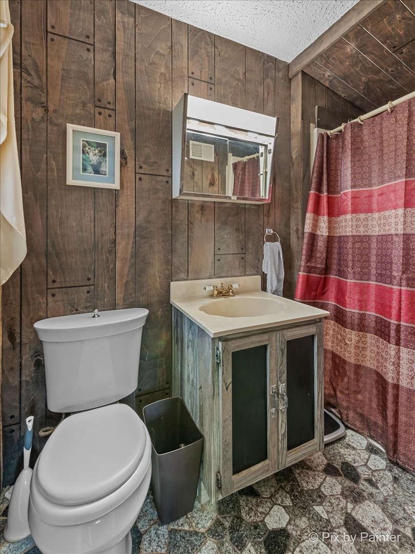612-3 Three Oaks Road Cary, IL 60013 - Photo 28 of 48 a bathroom with a sink toilet and shower