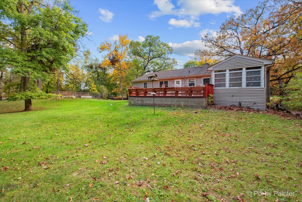 612-3 Three Oaks Road Cary, IL 60013 - Photo 33 of 48 a view of a house with a big yard and large trees