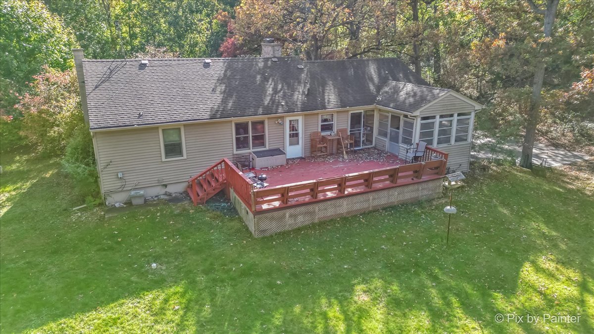 612-3 Three Oaks Road Cary, IL 60013 - Photo 34 of 48 a view of a house with a yard deck and sitting area