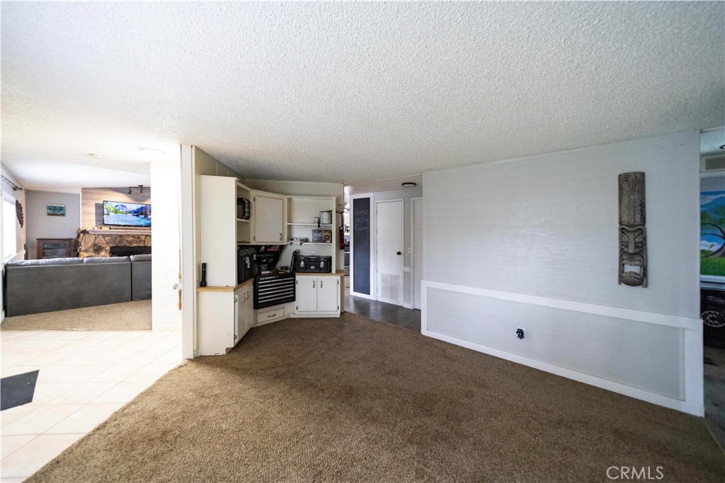 33671 The Farm Road Wildomar, CA 92595 - Photo 21 of 73 a view of a living room hardwood and a kitchen