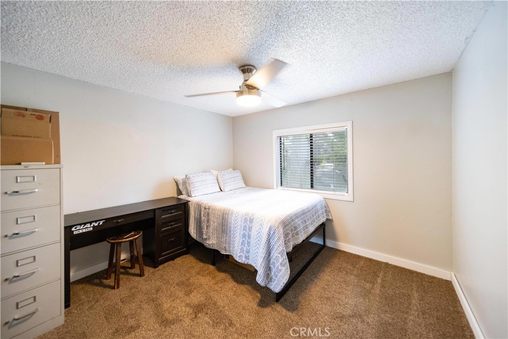 33671 The Farm Road Wildomar, CA 92595 - Photo 28 of 73 a bedroom with a bed and a cabinets