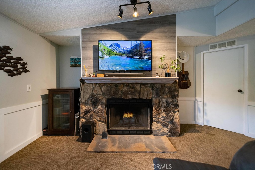 33671 The Farm Road Wildomar, CA 92595 - Photo 3 of 73 a living room with furniture and a fireplace
