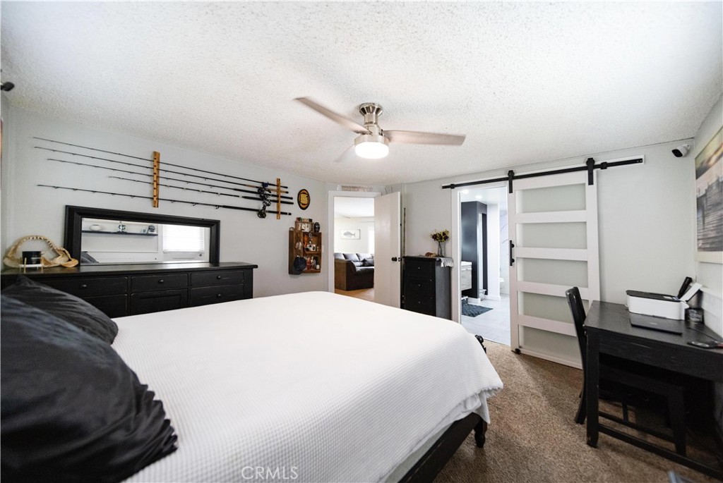 33671 The Farm Road Wildomar, CA 92595 - Photo 33 of 73 a bed room with a bed and a television