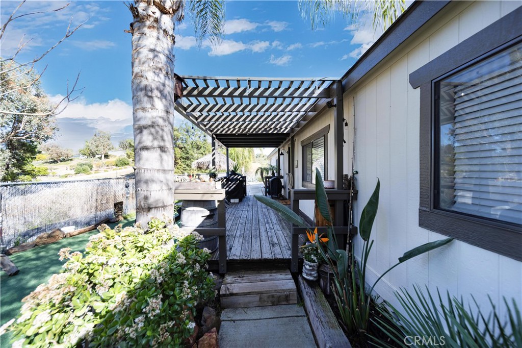 33671 The Farm Road Wildomar, CA 92595 - Photo 73 of 73 a view of balcony with wooden floor and outdoor seating