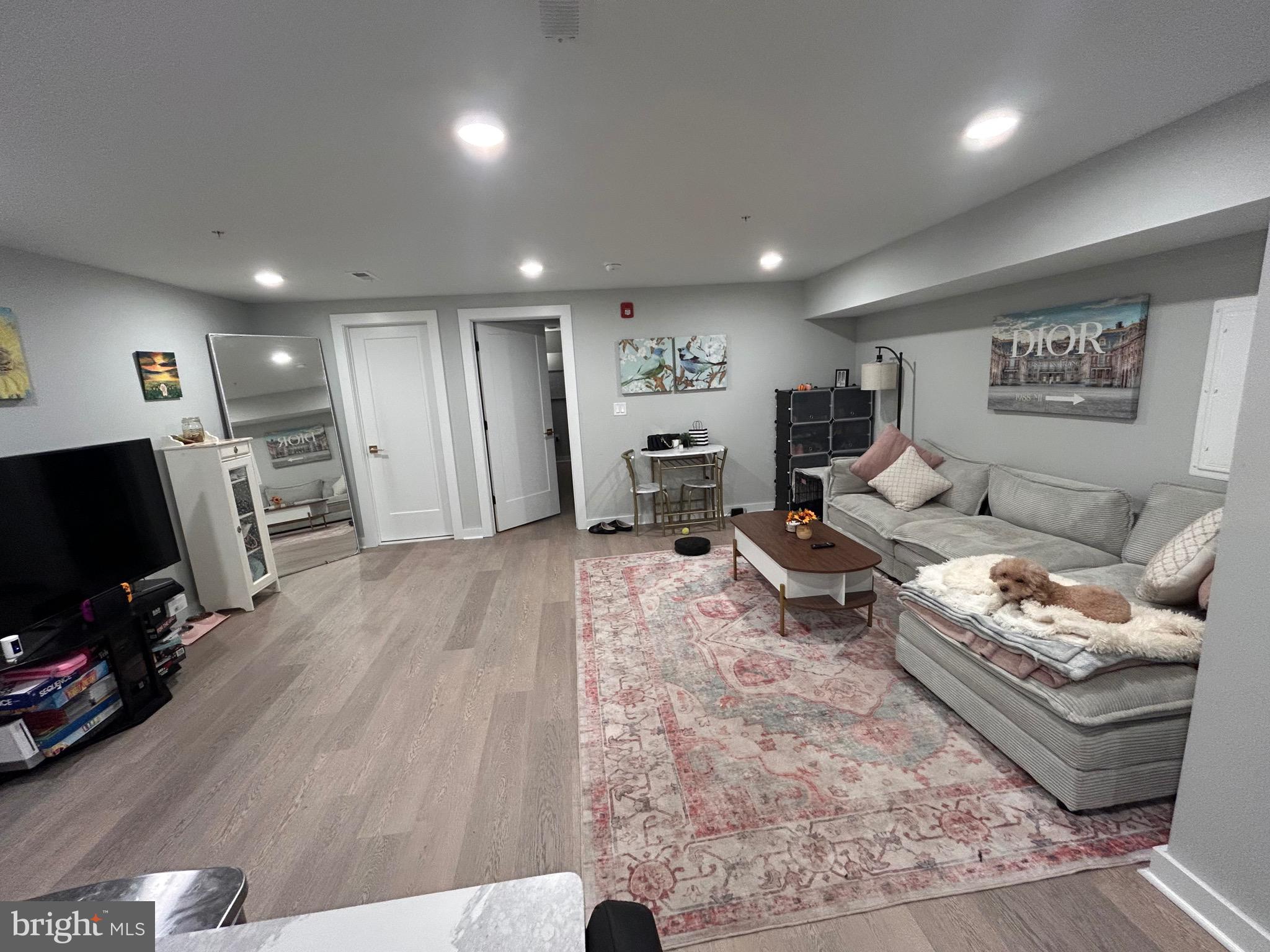 5830 Henry Philadelphia, PA 19128 - Photo 2 of 9 a living room with furniture and a flat screen tv