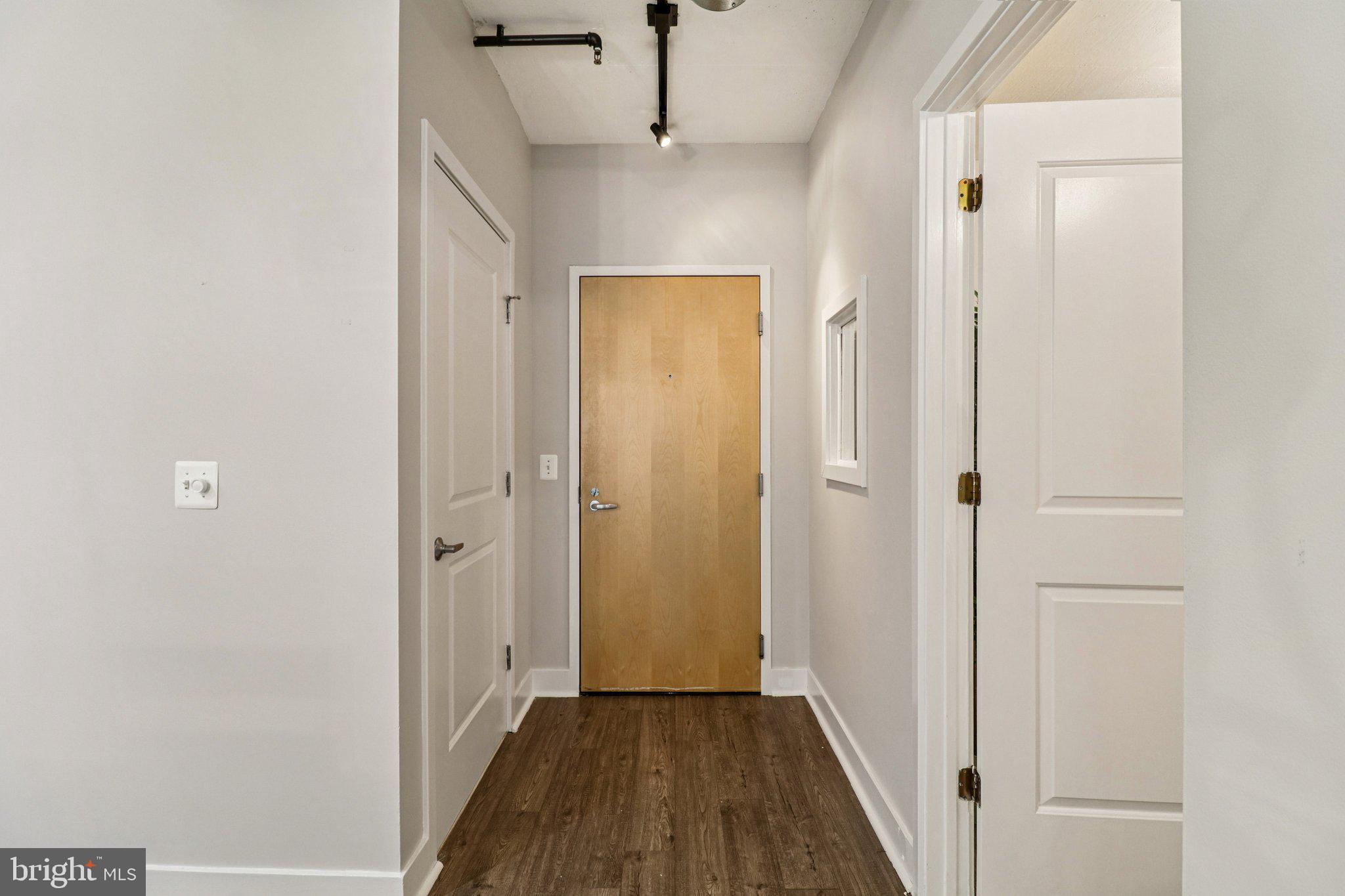 2125 14th Street Northwest, Unit 322 Washington, DC 20009 - Photo 11 of 37 a view of a hallway with wooden floor