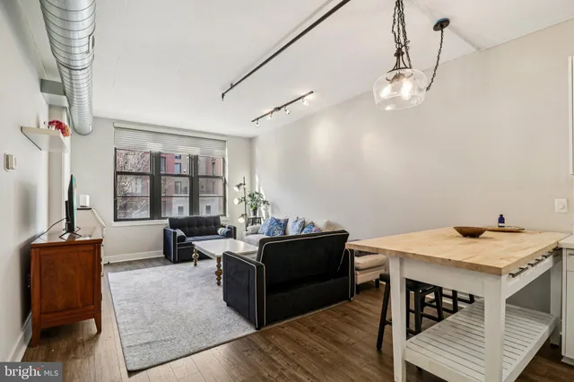 a view of a livingroom with furniture and window