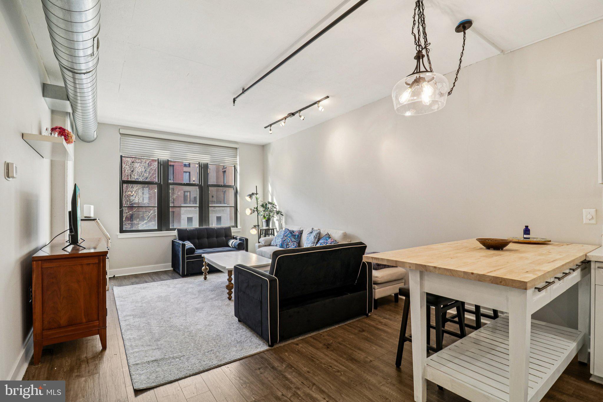 2125 14th Street Northwest, Unit 322 Washington, DC 20009 - Photo 12 of 37 a view of a livingroom with furniture and window
