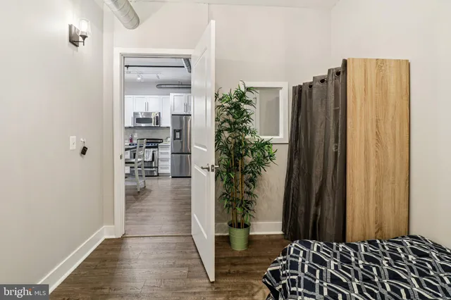 a view of entryway with livingroom and wooden floor
