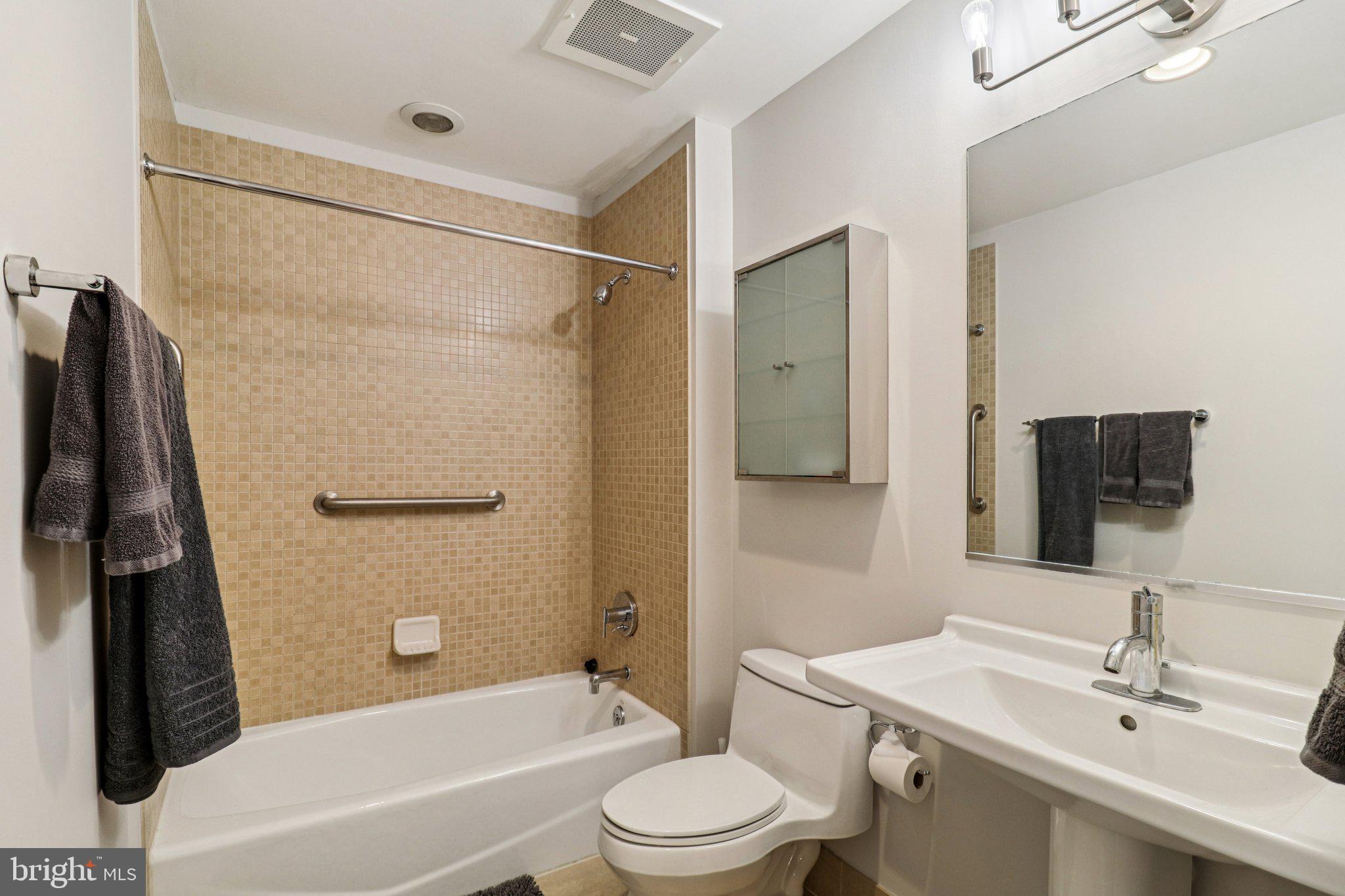 2125 14th Street Northwest, Unit 322 Washington, DC 20009 - Photo 22 of 37 a bathroom with a sink toilet and shower