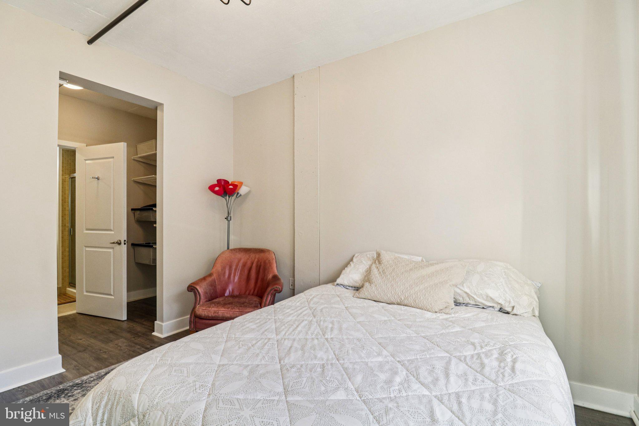 2125 14th Street Northwest, Unit 322 Washington, DC 20009 - Photo 26 of 37 a bedroom with a bed and a window