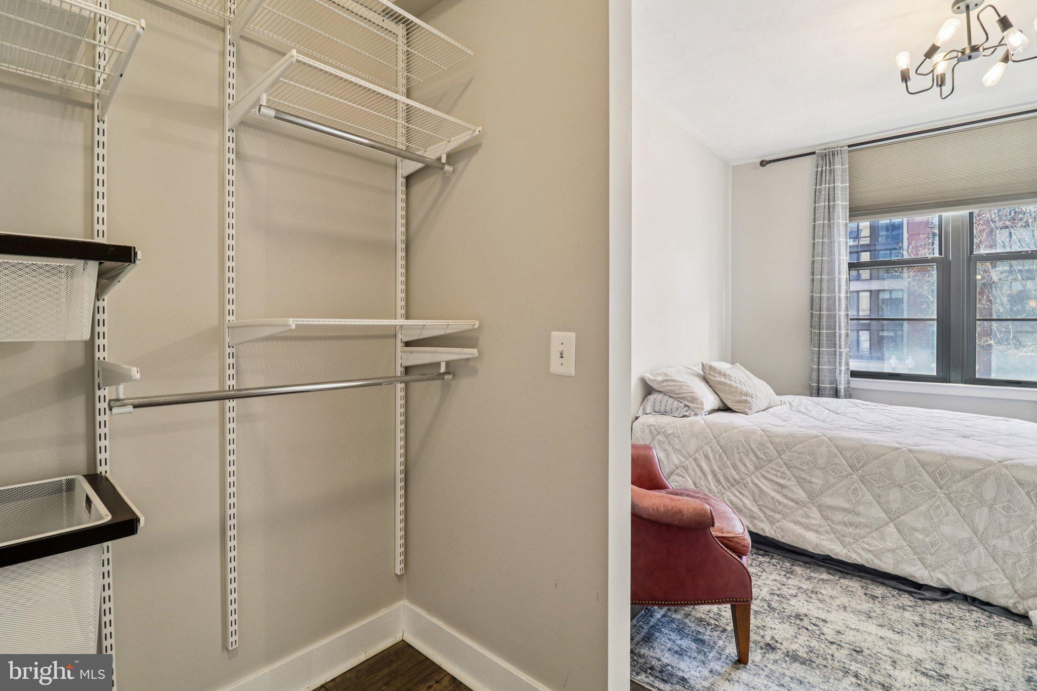 2125 14th Street Northwest, Unit 322 Washington, DC 20009 - Photo 31 of 37 a bedroom with a bed and a window