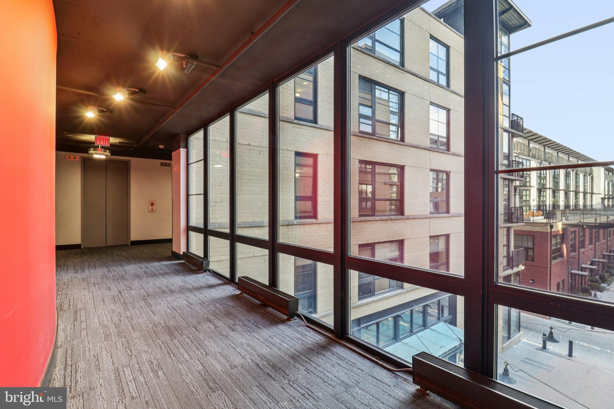 2125 14th Street Northwest, Unit 322 Washington, DC 20009 - Photo 34 of 37 a view of an entryway with wooden floor and windows