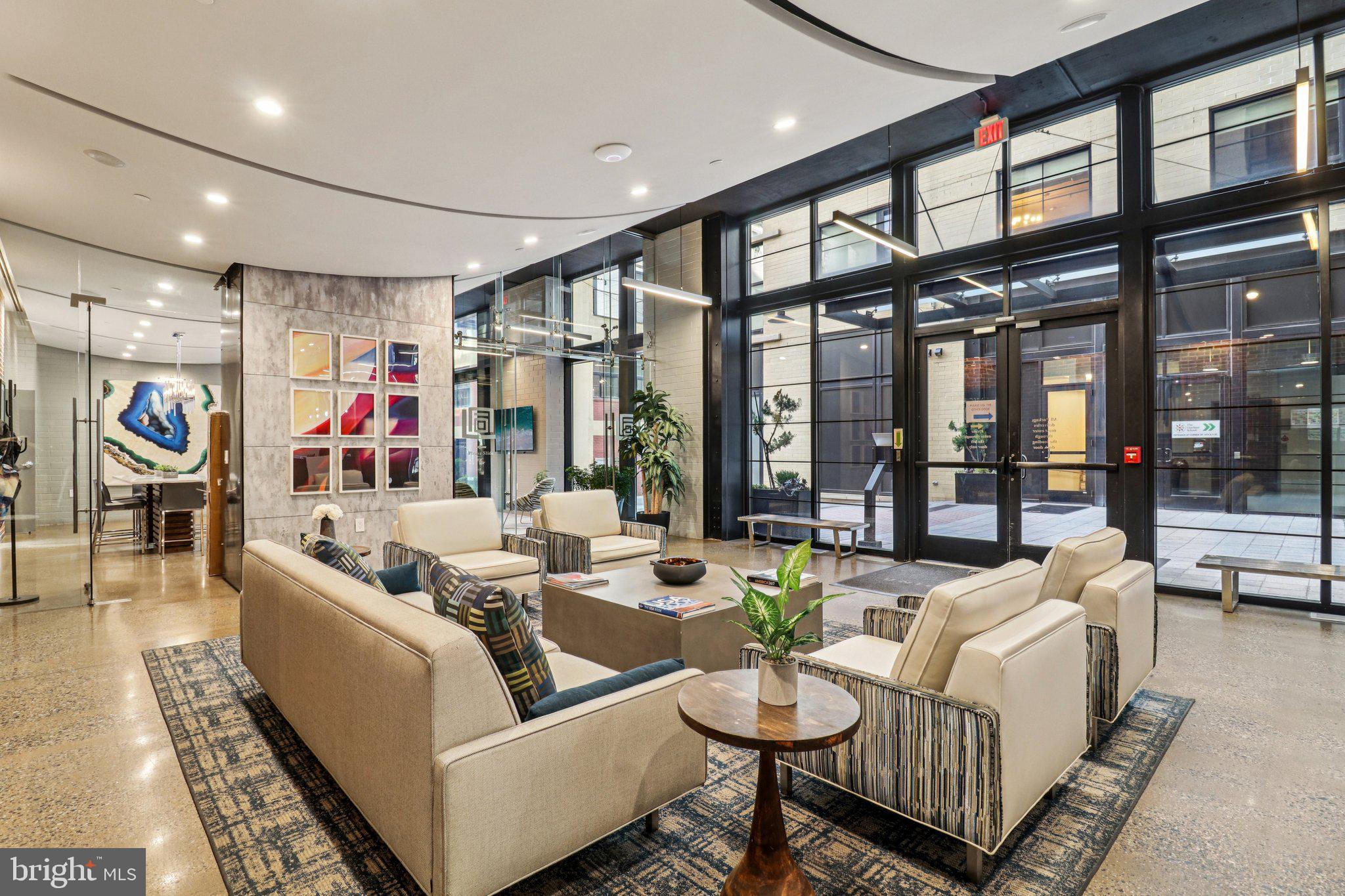 2125 14th Street Northwest, Unit 322 Washington, DC 20009 - Photo 8 of 37 a living room with furniture and a large window